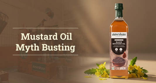 Anveshan black mustard oil bottle with flowers and oil extraction setup